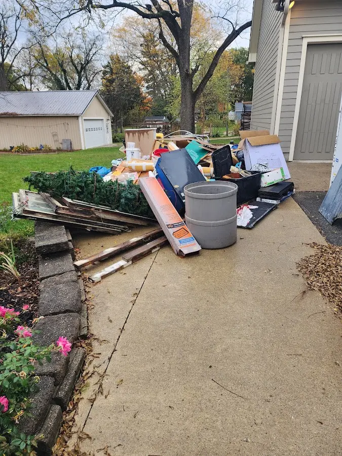Dumpster being loaded with debris for 30 Yard Dumpster Rental in Perth Amboy